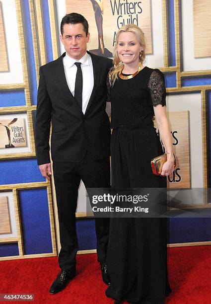 Writer Jason Hall and wife Elisha Hall arrive at the 2015 Writers Guild Awards at the Hyatt Regency Century Plaza on February 14, 2015 in Los...