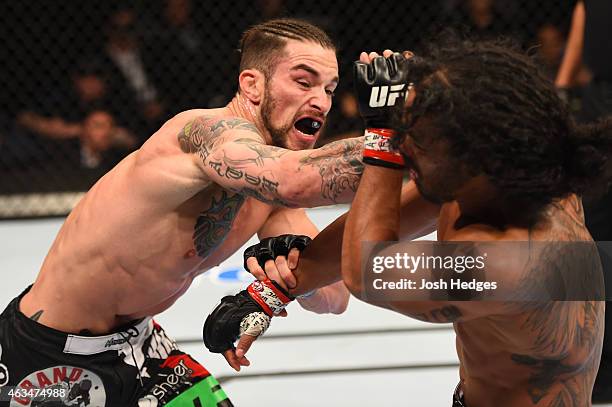 Brandon Thatch punches Benson Henderson in their welterweight fight during the UFC Fight Night event inside 1stBank Center on February 14, 2015 in...