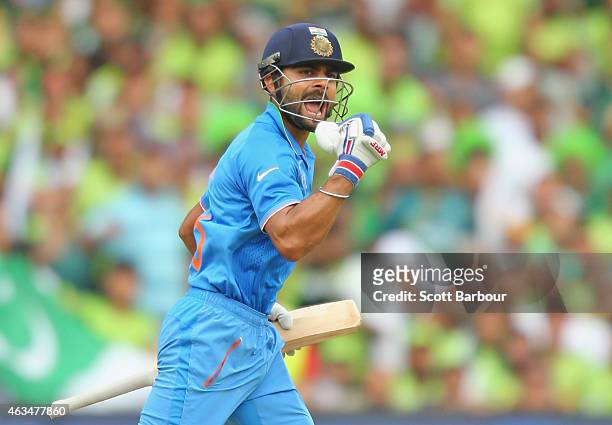 Virat Kohli of India celebrates as he reaches his century during the 2015 ICC Cricket World Cup match between India and Pakistan at Adelaide Oval on...