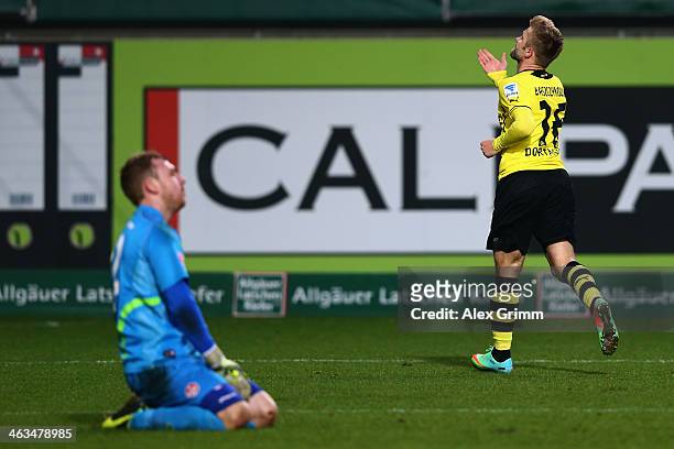 Jakub Blaszczykowski of Dortmund celebrates his team's second goal as goalkeeper David Hohs of Kaiserslautern reacts during the friendly match...