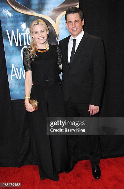 Writer Jason Hall and wife Elisha Hall arrive at the 2015 Writers Guild Awards at the Hyatt Regency Century Plaza on February 14, 2015 in Los...