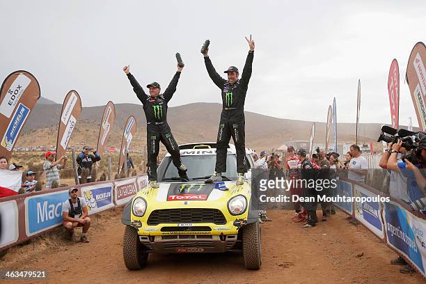 Nani Roma of Spain and Michel Perin of France for MINI and the Monster Energy X-Raid Team celebrate on the finish line after winning the 2014 Dakar...