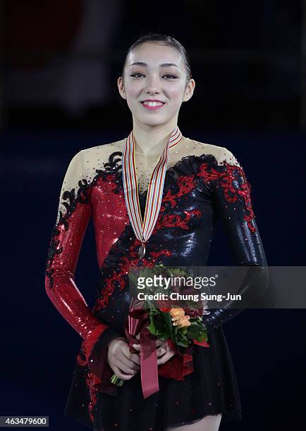 Second place winner Rika Hongo of Japan poses on the podium after the medals ceremony of the Ladies Singles Skating on day four of the ISU Four...