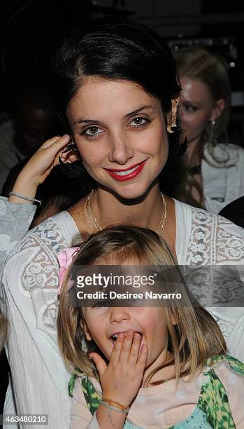 Designer Ana Beatriz Leraro and her daughter attend the Robert Geller fashion show during Mercedes-Benz Fashion Week Fall 2015 at Pier 59 on February...