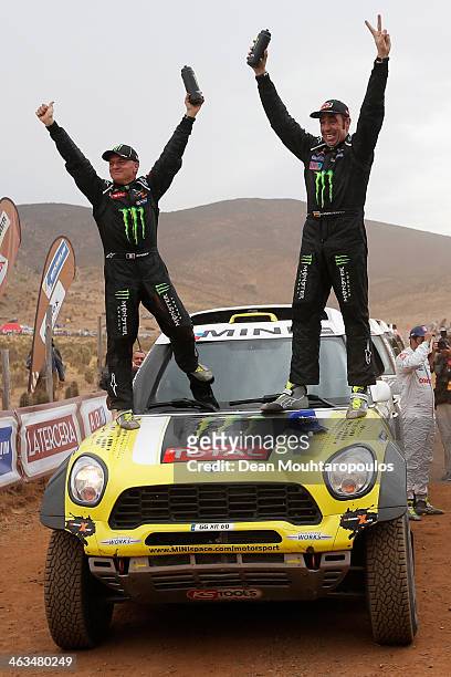 Nani Roma of Spain and Michel Perin of France for MINI and the Monster Energy X-Raid Team celebrate on the finish line after winning the 2014 Dakar...