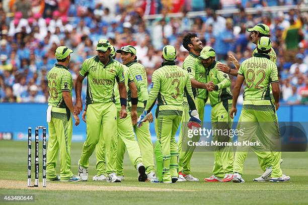 Sohail Khan of Pakistan celebrates with teammates after bowling out Ajinkya Rahane of India to claim his sixth wicket during the 2015 ICC Cricket...