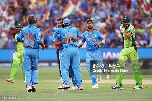 Mohammed Shami of India is congratulated by teammates after he got the wicket of Younus Khan of Pakistan during the 2015 ICC Cricket World Cup match...