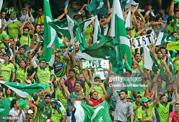 Pakistan supporters wave their flags as they celebrate a boundary during the 2015 ICC Cricket World Cup match between India and Pakistan at the...