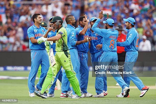 Mohammed Shami of India is congratulated by teammates after he got the wicket of Younus Khan of Pakistan during the 2015 ICC Cricket World Cup match...