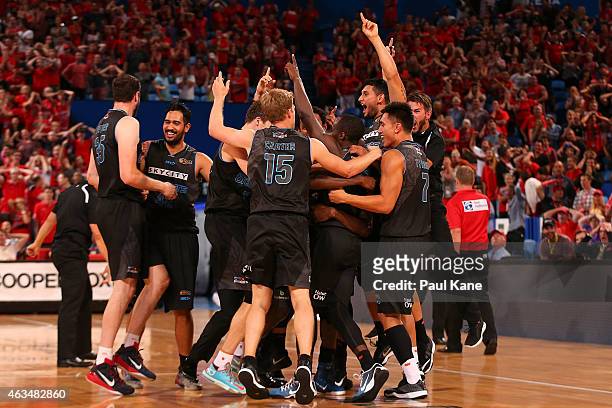 The Breakers celebrate after a three point shot by Cedric Jackson to win the game in double overtime during the NBL Rd 19 game between the Perth...