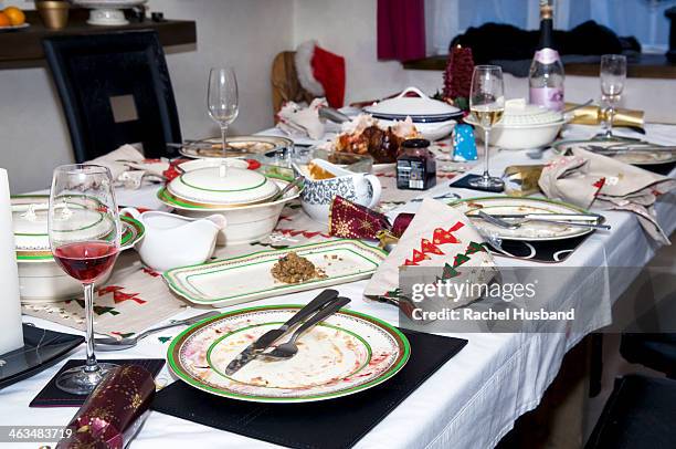 abandoned christmas dinner table after eating - messy table stock pictures, royalty-free photos & images