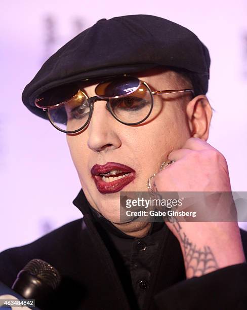 Singer Marilyn Manson speaks to an interviewer during the Black Heart Ball at Hyde Bellagio at the Bellagio on February 14, 2015 in Las Vegas, Nevada.