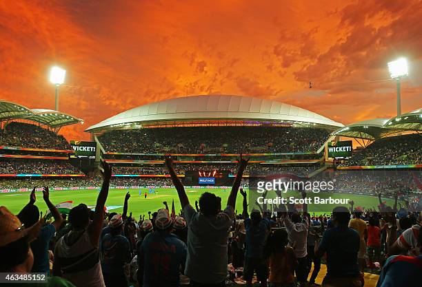 General view as Indian fans in the crowd celebrate as a Pakistan wicket falls during the 2015 ICC Cricket World Cup match between India and Pakistan...