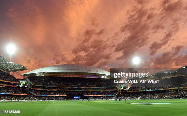 General view shows the scene as the sun sets, at the Adelaide Oval during the 2015 Cricket World Cup match between India and Pakistan in Adelaide on...