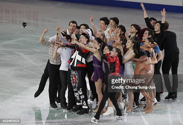 Misha Ge of Uzbekistan takes a selfie with other skaters after the Gala Exhibition on day four of the ISU Four Continents Figure Skating...