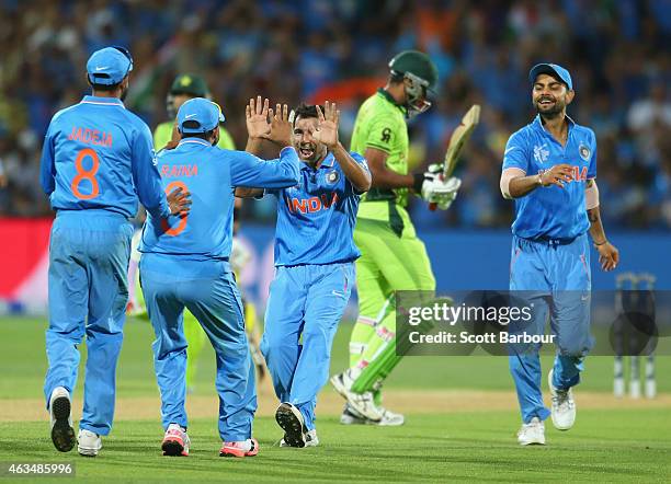 Mohammed Shami of India celebrates with his teammates after dismissing Wahab Riaz of Pakistan during the 2015 ICC Cricket World Cup match between...