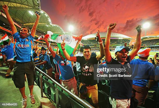 Indian fans in the crowd celebrate as a Pakistan wicket falls during the 2015 ICC Cricket World Cup match between India and Pakistan at Adelaide Oval...