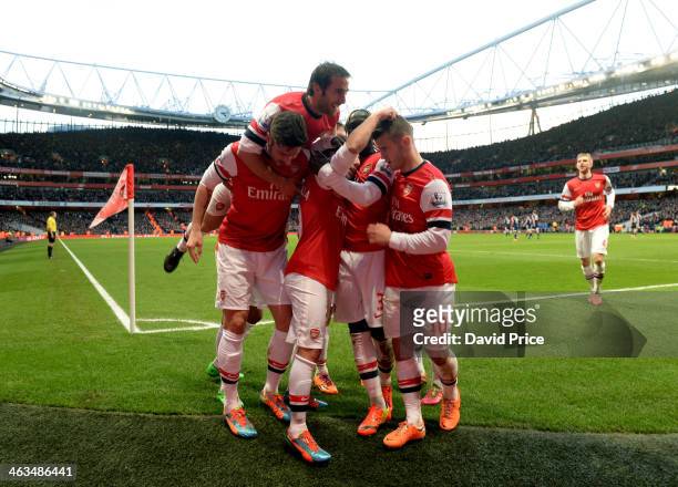 Santi Cazorla celebrates scoring his and Arsenal's 1st goal with Olivier Giroud, Mathieu Flamini and Jack WIlshere during the match between Arsenal...