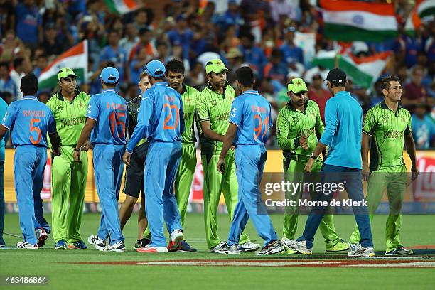 Players from both teams shake hands after the 2015 ICC Cricket World Cup match between India and Pakistan at Adelaide Oval on February 15, 2015 in...