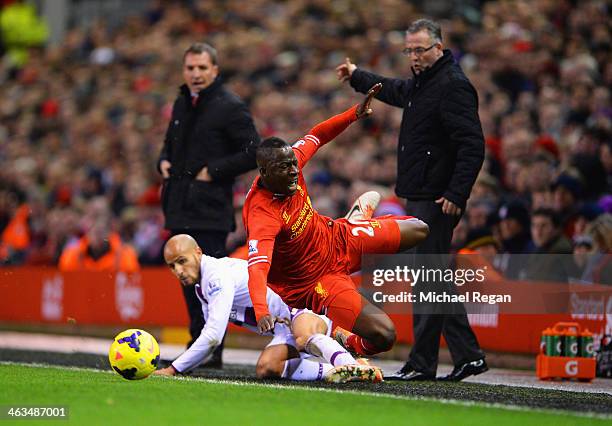 Aly Cissokho of Liverpool is challenged by Karim El Ahmadi of Aston Villa during the Barclays Premier League match between Liverpool and Aston Villa...