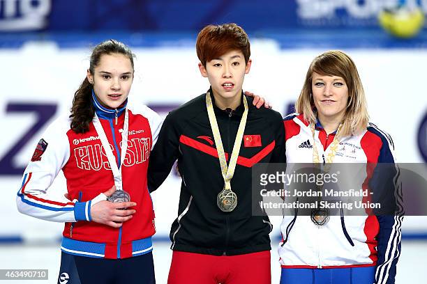 Gold medalist Fan Kexin of China , Silver medalist Sofia Prosvirnova of Russia and Elise Christie of Great Britain pose for a picture with their...