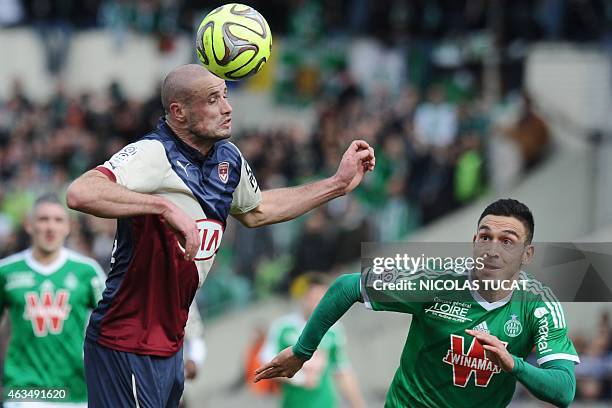 Bordeaux's French defender Nicolas Pallois vies with St Etienne's Turkish forward Mevlut Erding during the French L1 football match between Girondins...