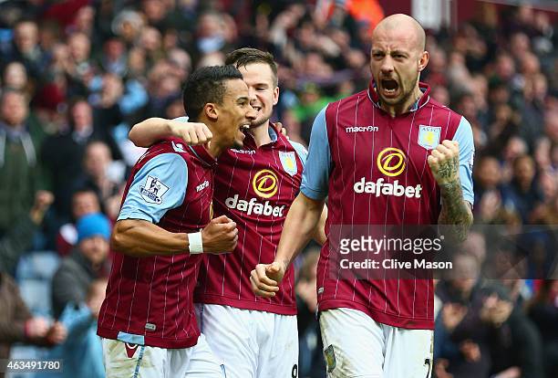 Scott Sinclair of Aston Villa celebrates scoring their second goal with Tom Cleverley and Alan Hutton of Aston Villa during the FA Cup fifth round...
