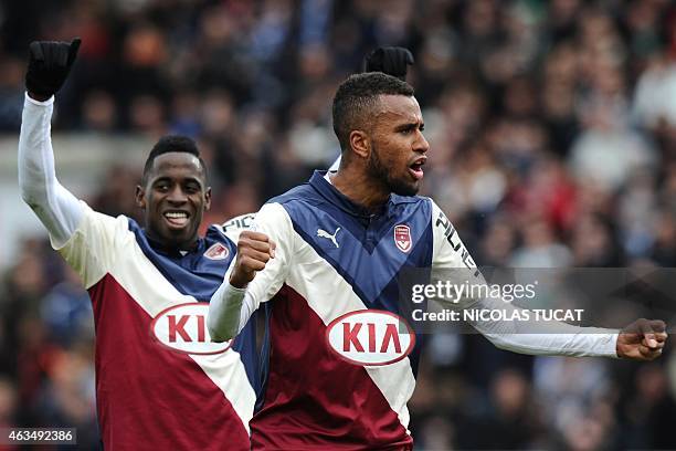 Bordeaux's Swedish forward Isaac Kiese Thelin and Bordeaux's Gabonese midfielder Andre Biyogo Poko celebrate at the end of the French L1 football...