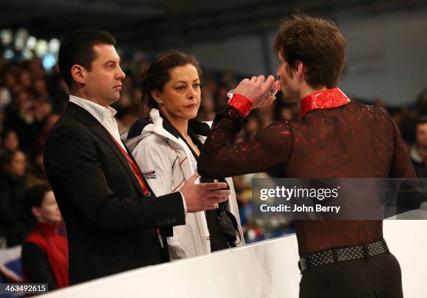 Brian Joubert of France gets a last advice from his coach Veronique Guyon and his choregrapher Nikolai Morozov before competing in the Men Free...