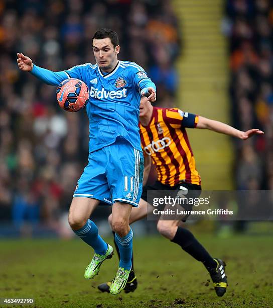 Adam Johnson of Sunderland controls the ball under pressure from Stephen Darby of Bradford during the FA Cup Fifth Round match between Bradford City...