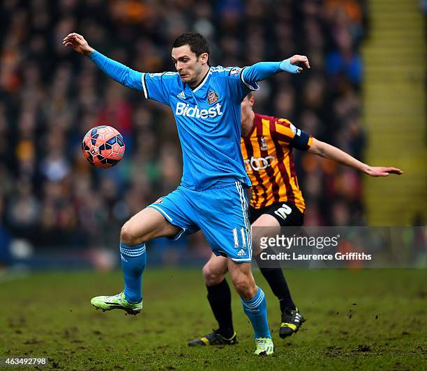 Adam Johnson of Sunderland controls the ball under pressure from Stephen Darby of Bradford during the FA Cup Fifth Round match between Bradford City...
