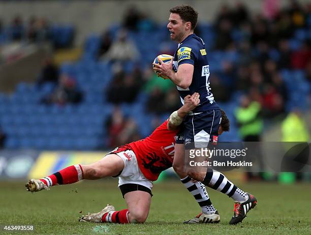 Joe Ford of Sale is tackled by Jamie Lewis of London Welsh during the Aviva Premiership match between London Welsh and Sale Sharks at Kassam Stadium...