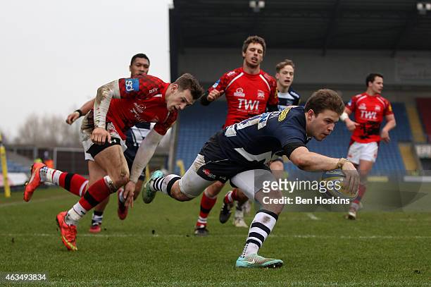 Will Addison of Sale dives over to score a try during the Aviva Premiership match between London Welsh and Sale Sharks at Kassam Stadium on February...