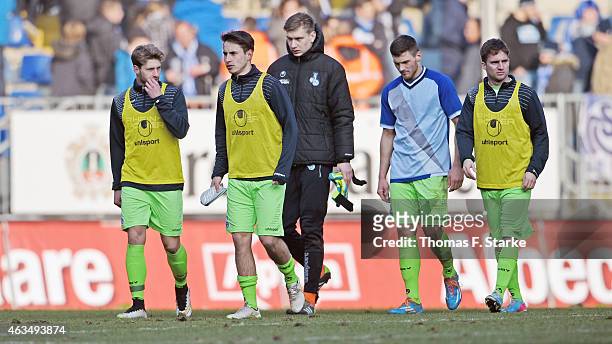 Players of Duisburg walk off the pitch dejected during the Third League match between Arminia Bielefeld and MSV Duisburg at Schueco Arena on February...