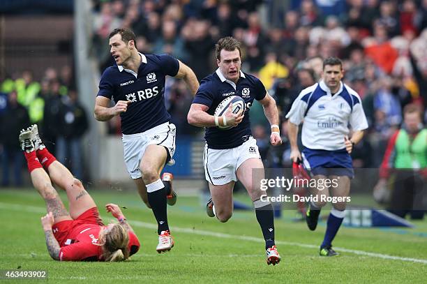 Stuart Hogg of Scotland breaks away to score the opening try during the RBS Six Nations match between Scotland and Wales at Murrayfield Stadium on...