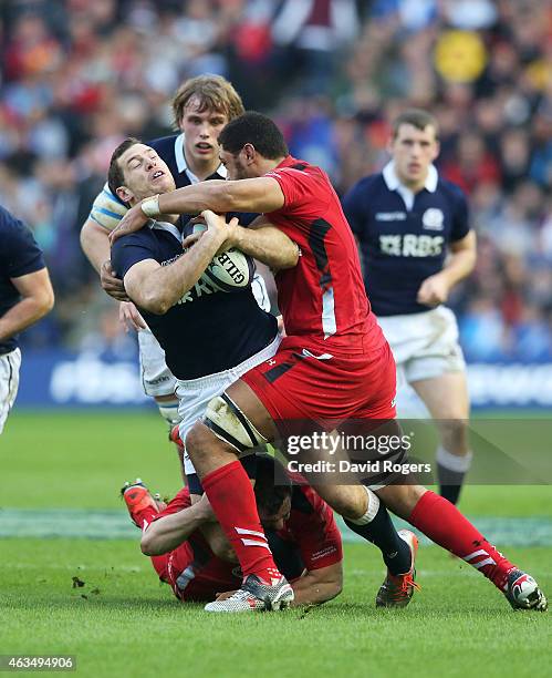 Tim Visser of Scotland is stopped by Toby Faletau of Wales during the RBS Six Nations match between Scotland and Wales at Murrayfield Stadium on...