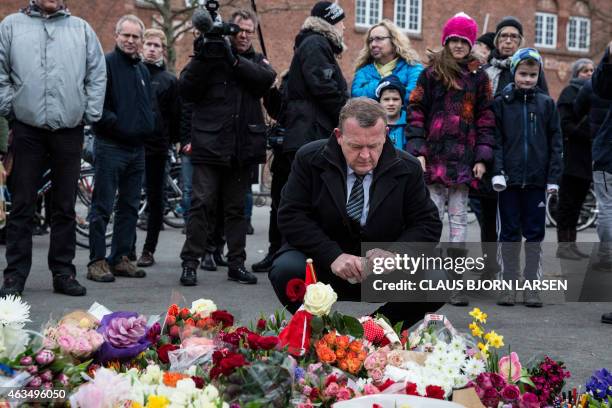 Former Prime Minister of Denmark Lars Lokke Rasmussen is pictured as he looks at flowers outside the cultural center "Kruttoende" in Copenhagen on...