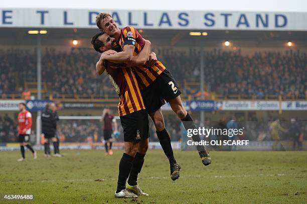 Bradford City's Potuguese midfielder Filipe Morais and Bradford City's English defender Stephen Darby celebrate on th epitch after the FA Cup fifth...