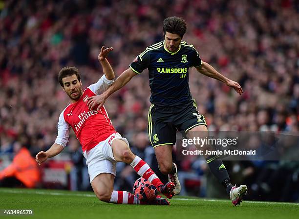 Mathieu Flamini of Arsenal slides in to tackle George Friend of Middlesbrough during the FA Cup fifth round match between Arsenal and Middlesbrough...