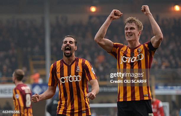 Bradford City's Potuguese midfielder Filipe Morais and Bradford City's English defender Stephen Darby celebrate on the pitch after the FA Cup fifth...