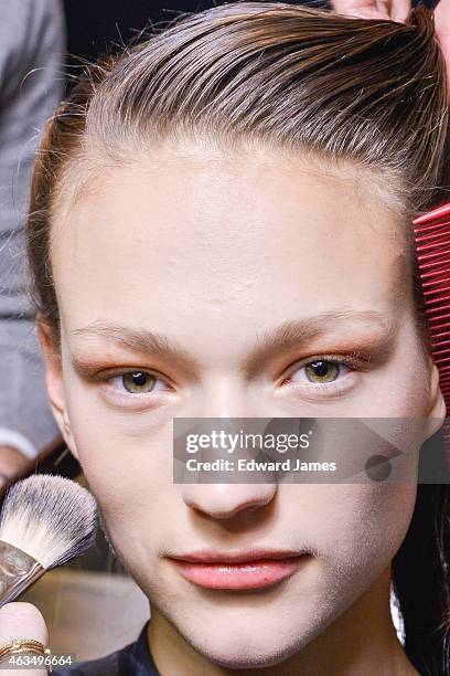 Model poses backstage at the Herve Leger by Max Azria fashion show at The Theatre at Lincoln Center on February 14, 2015 in New York City.