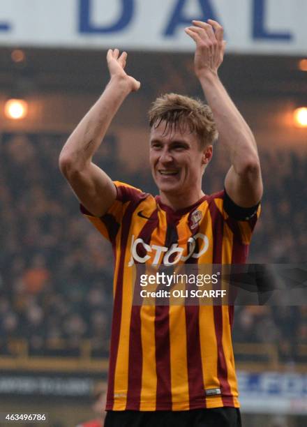 Bradford City's English defender Stephen Darby celebrates on the pitch after the FA Cup fifth round football match between Bradford City and...