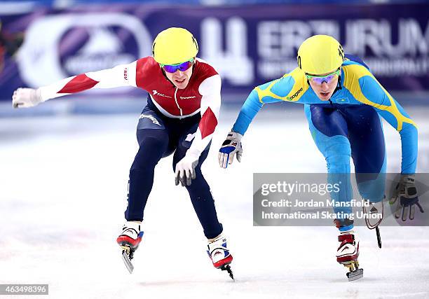 Denis Nikisha of Kazakhstan lunges for the line with Ruslan Zakharov of Russia during the Men's 1000m B final on day two of the ISU World Cup Short...