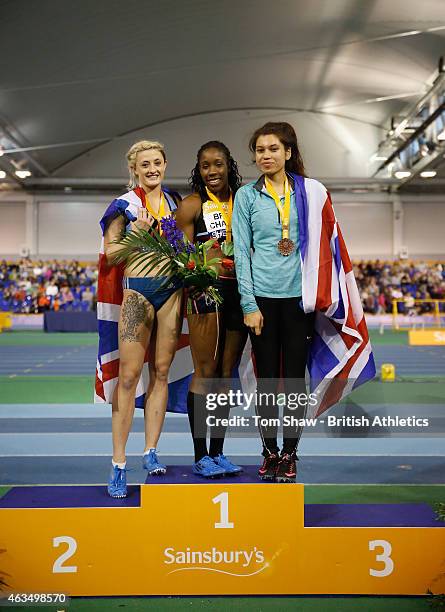 Lucy Hatton of Great Britain, Serita Solomon of Great Britain and Yasmin Miller of Great Britain pose on the podium after the womens 60m hurdles...