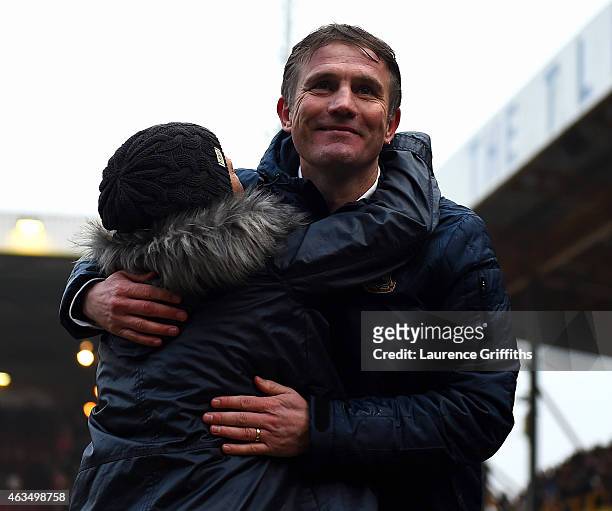 Phil Parkinson, manager of Bradford is congratulated by a fan after victory in the FA Cup Fifth Round match between Bradford City and Sunderland at...
