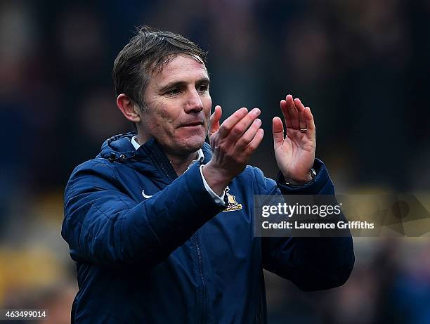 Phil Parkinson, manager of Bradford applauds the fans after victory in the FA Cup Fifth Round match between Bradford City and Sunderland at Coral...