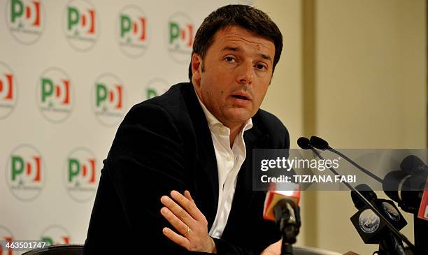 Democratic Party leader Matteo Renzi gives a press conference after a meeting with Italy's former Prime minister Silvio Berlusconi in Rome on January...