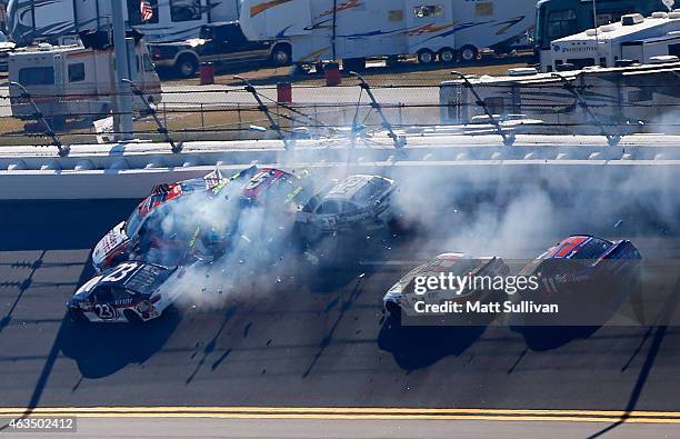 Reed Sorenson, driver of the Golden Coral Chevrolet, and Clint Bowyer, driver of the 5-hour ENERGY Toyota, Bobby Labonte, driver of the C&J Energy...