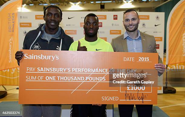 Nigel Levine is presented with a cheque for his Performance of the Day by Andy Turner and Linford Christie during the Sainsbury's British Athletics...