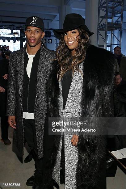 New York Giants Victor Cruz and singer Kelly Rowland attend Public School runway show during MADE Fashion Week Fall 2015 at Studio 330 on February...